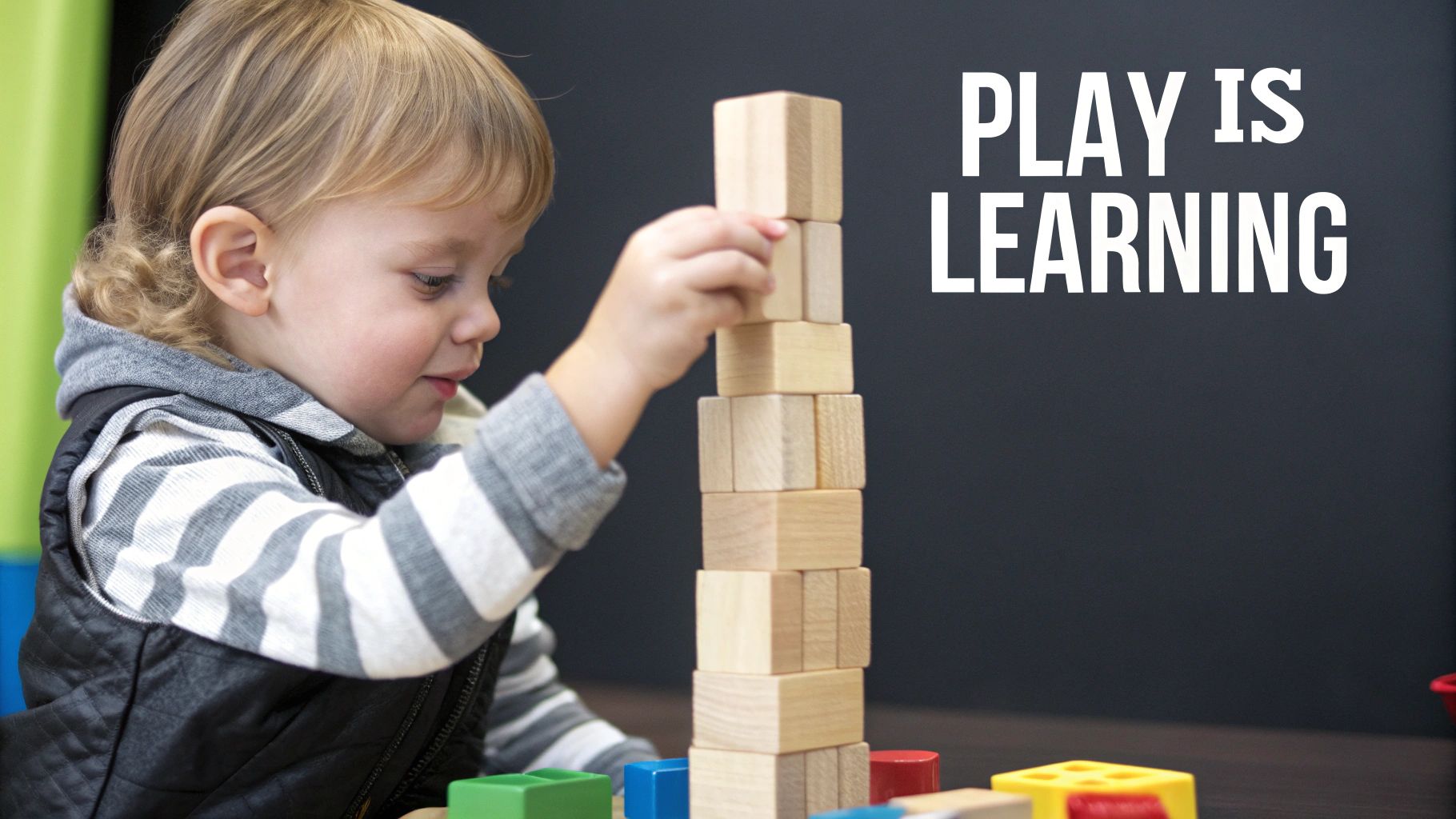 A happy toddler looking at the camera, symbolizing the completion of the sensorimotor stage.