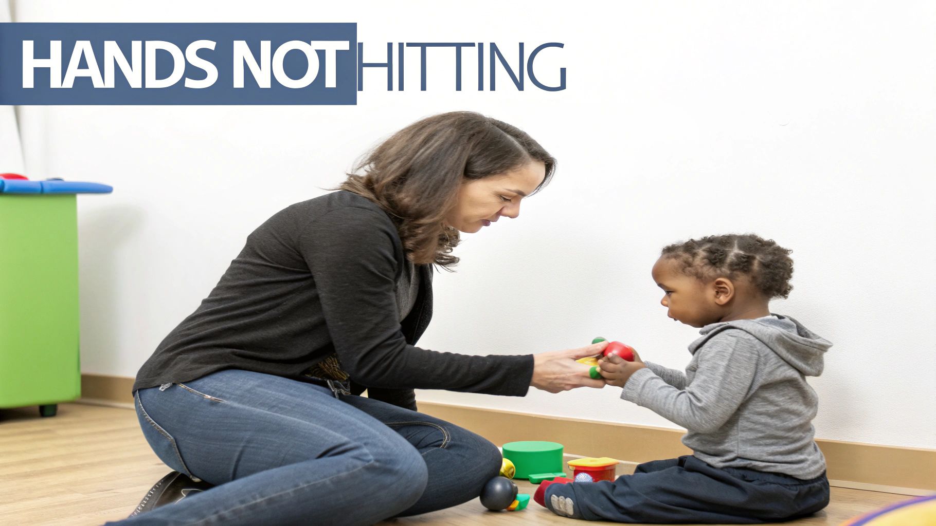 A young child looking frustrated while a parent gently holds their hand