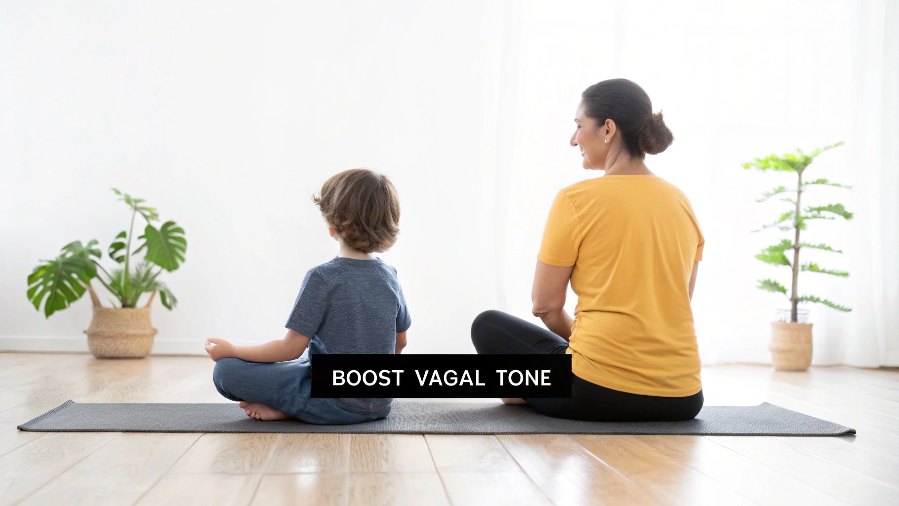 A woman and child meditate on a yoga mat, boosting vagal tone and promoting relaxation.