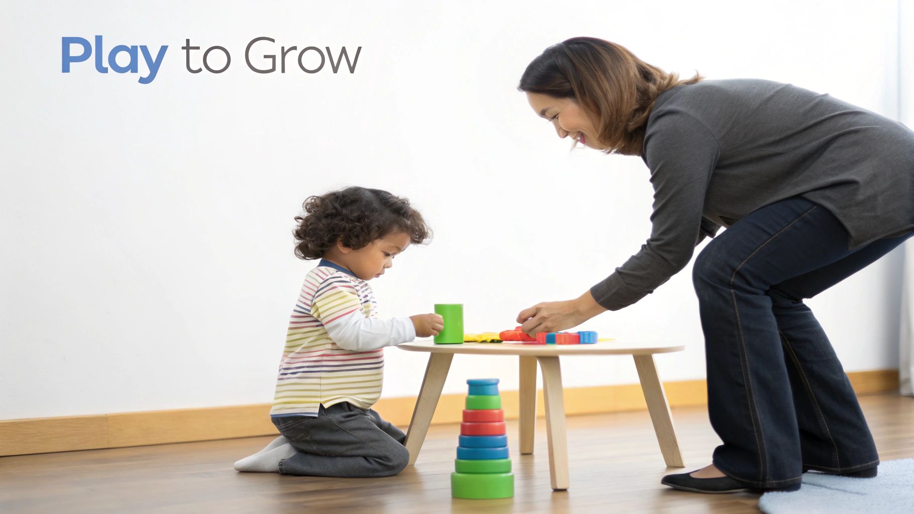 A young child playing with colorful blocks on the floor, focusing intently on their task.
