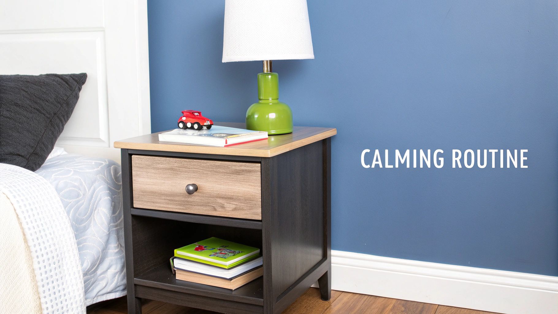 A serene bedroom features a bedside table with a lamp, books, and a toy car, promoting a calming routine.
