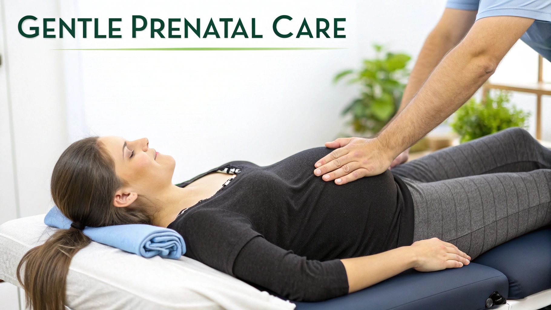 A professional provides gentle prenatal care to a pregnant woman lying on a treatment table.