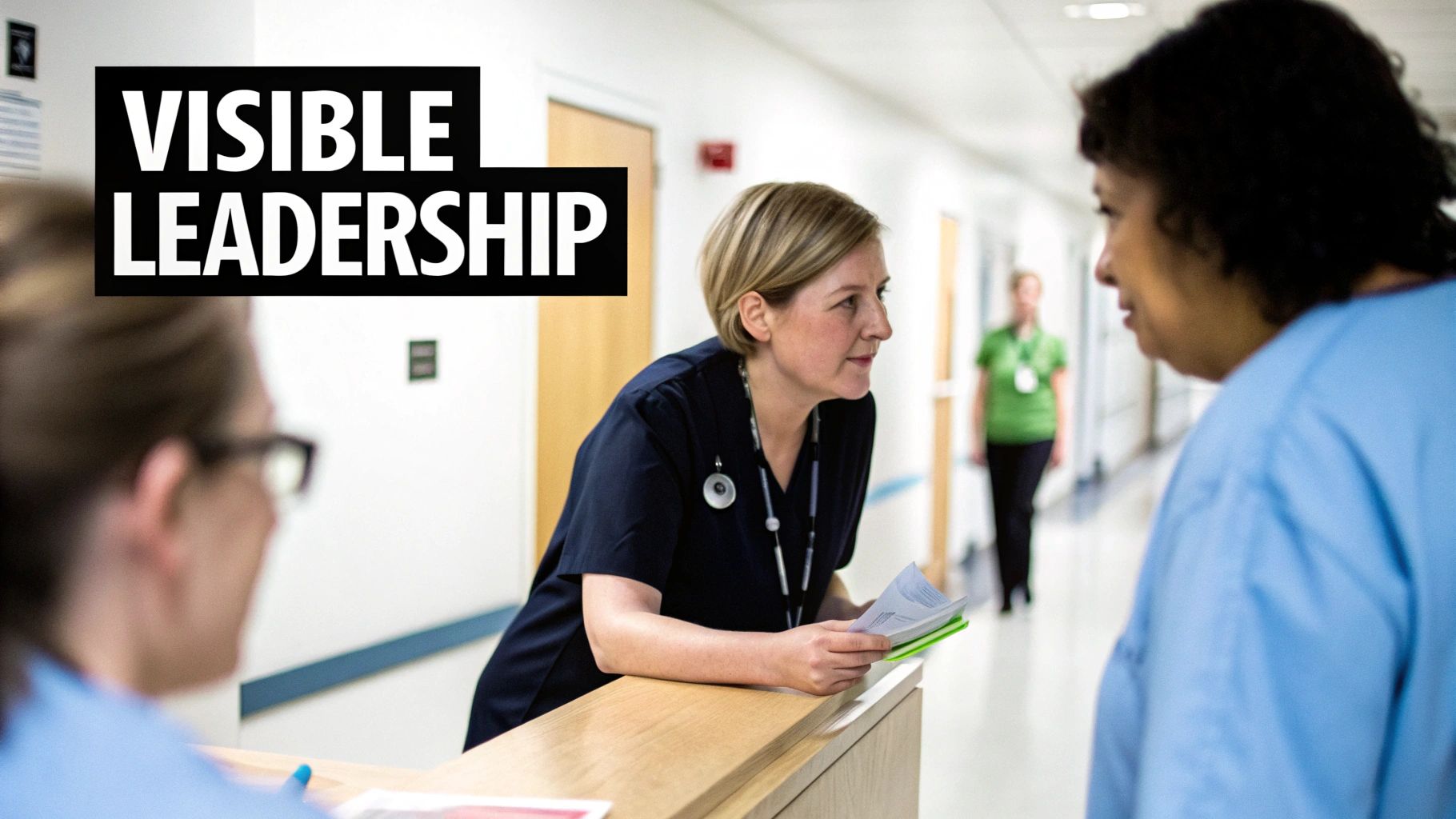 Nurses in uniform discussing at a hospital counter, embodying visible leadership.
