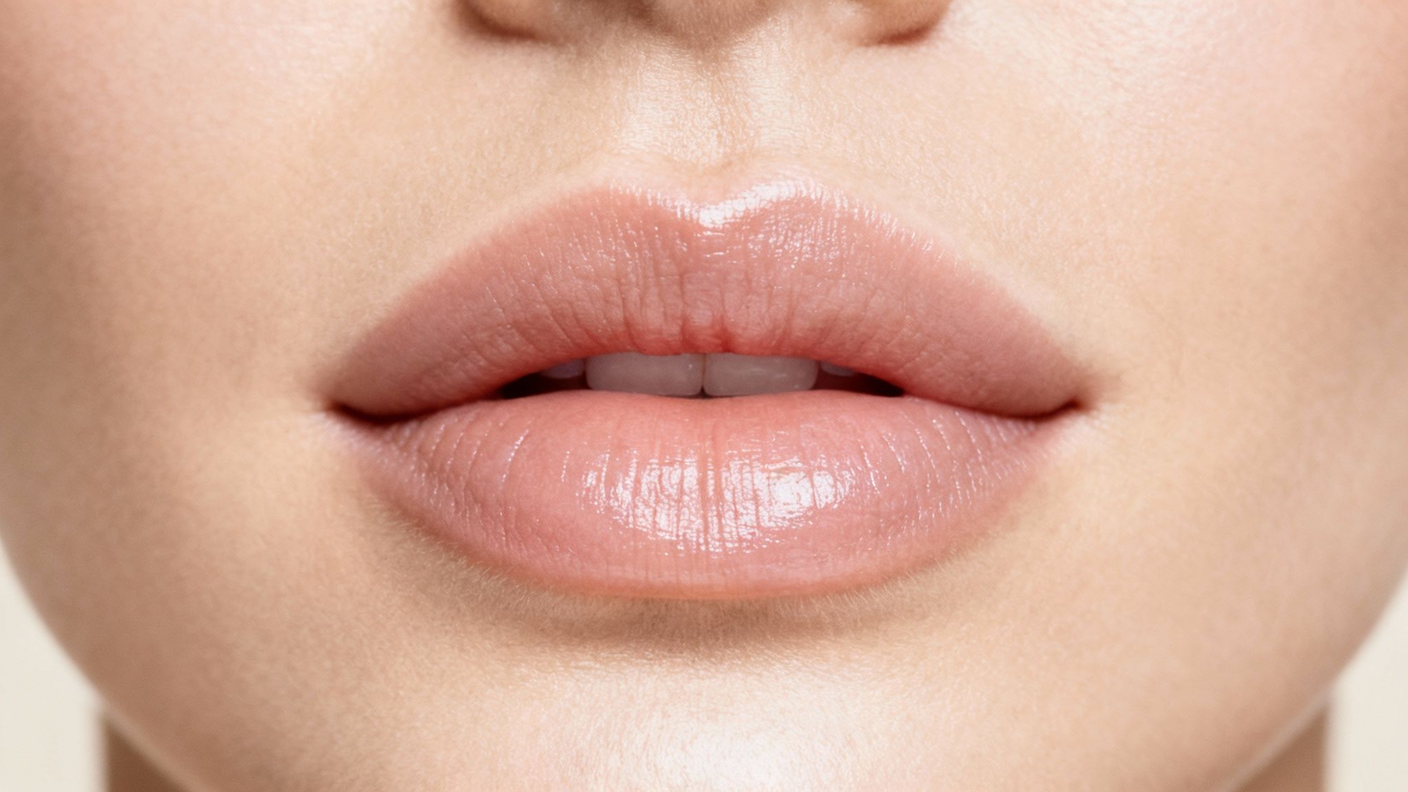 A close-up of beautifully enhanced lips, representing the results of Juvederm Volbella