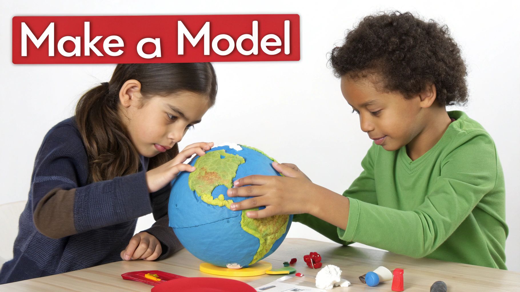 Two children, a girl and a boy, intently making a blue and green Earth model.