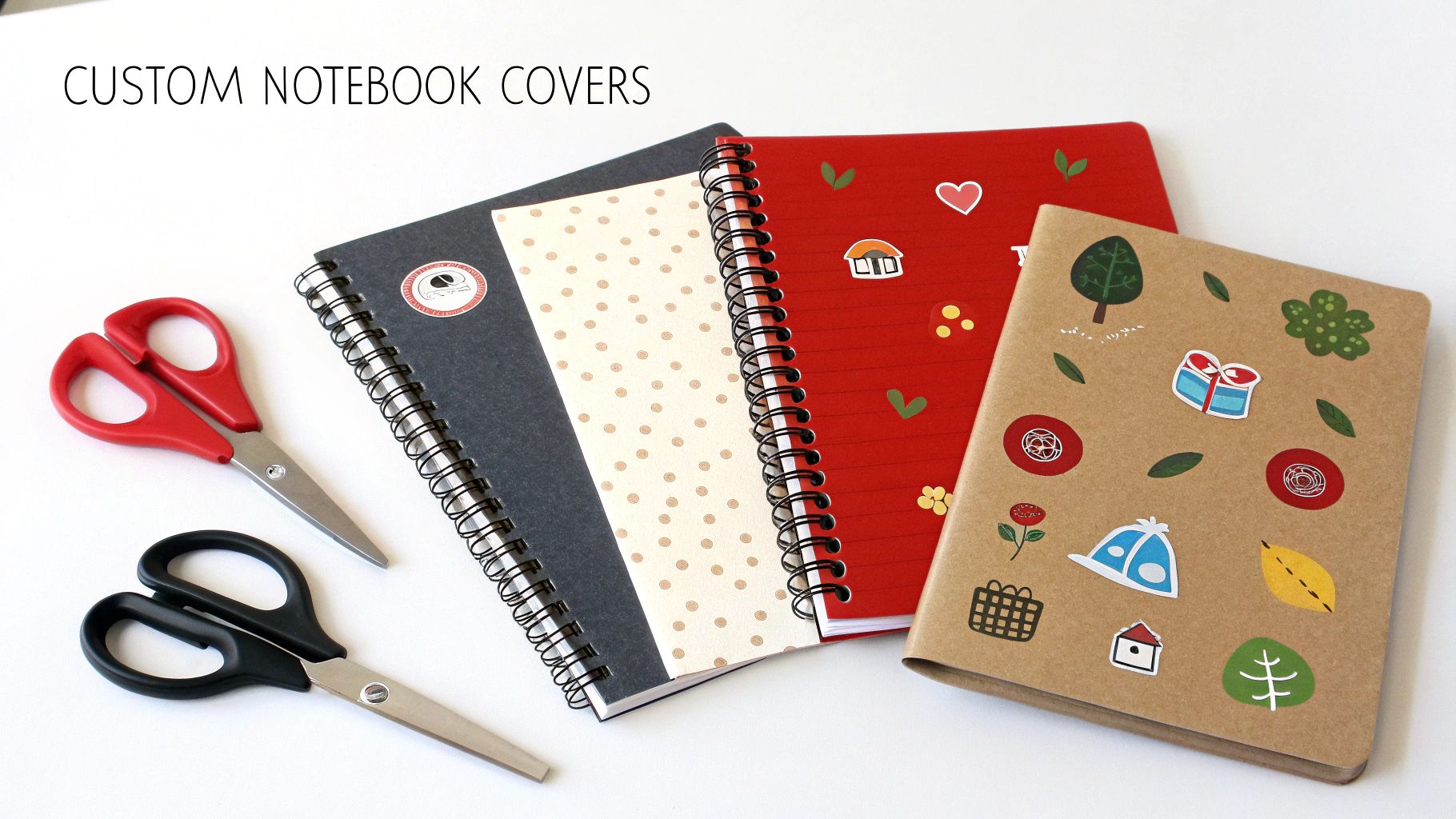 Four custom-decorated notebooks in various colors, along with red and black scissors, ideal for DIY school supplies.