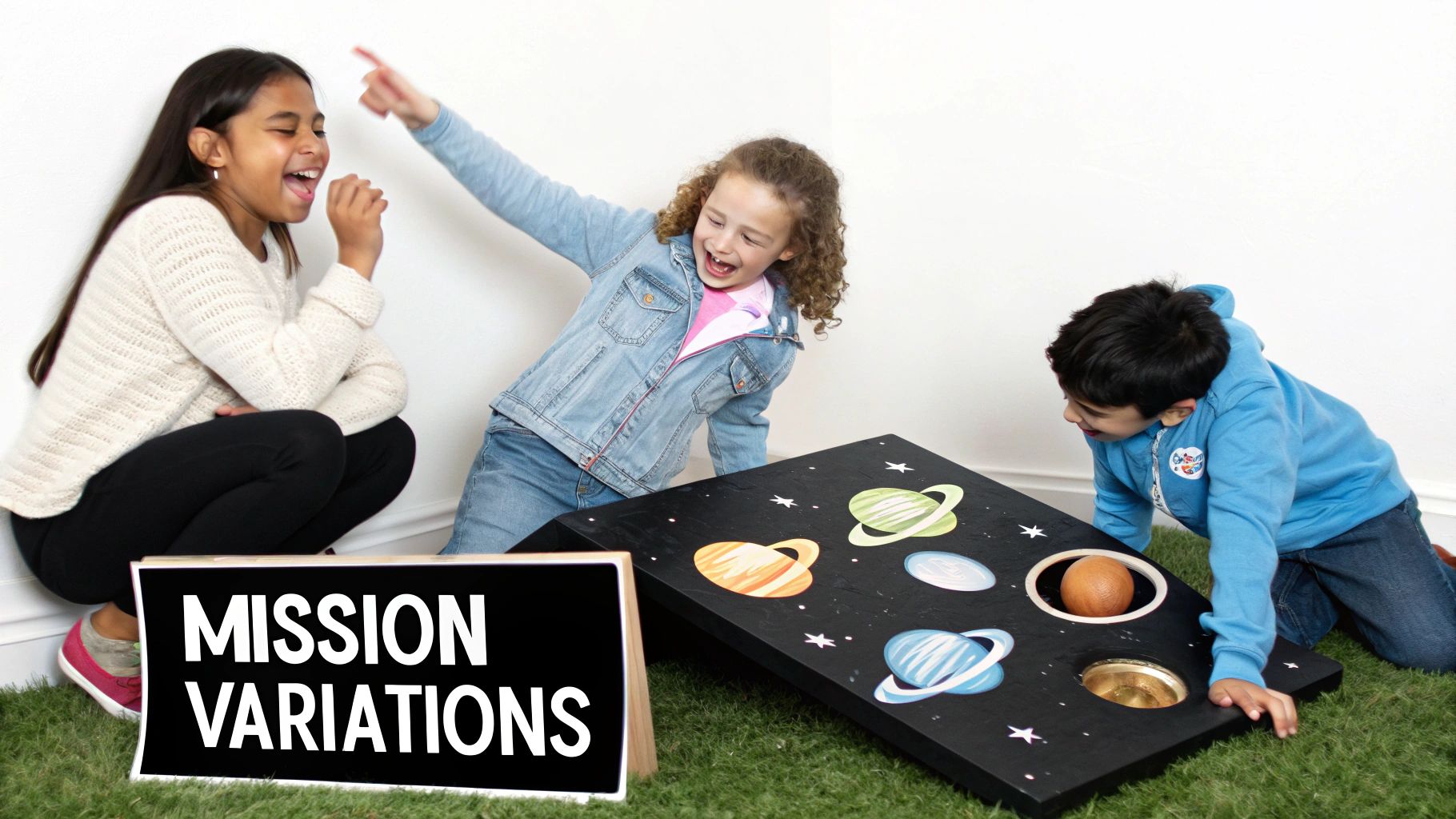 Three happy children playing an outer space themed bean bag toss game on a green carpet.