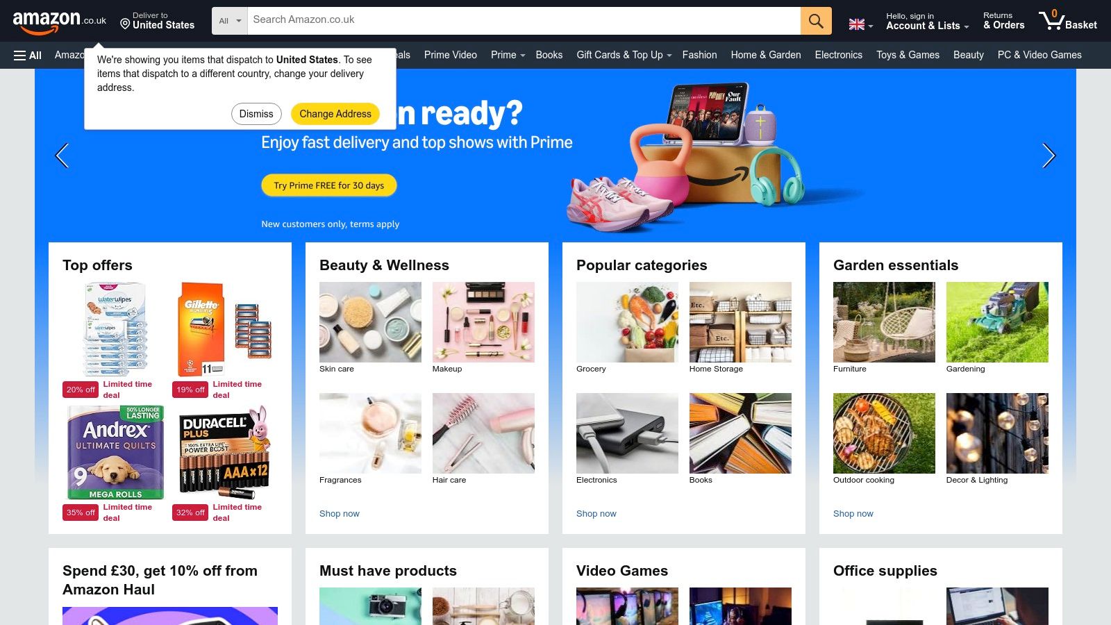 A person shopping online for kids' building games on a laptop, with colourful construction toys visible in the background.