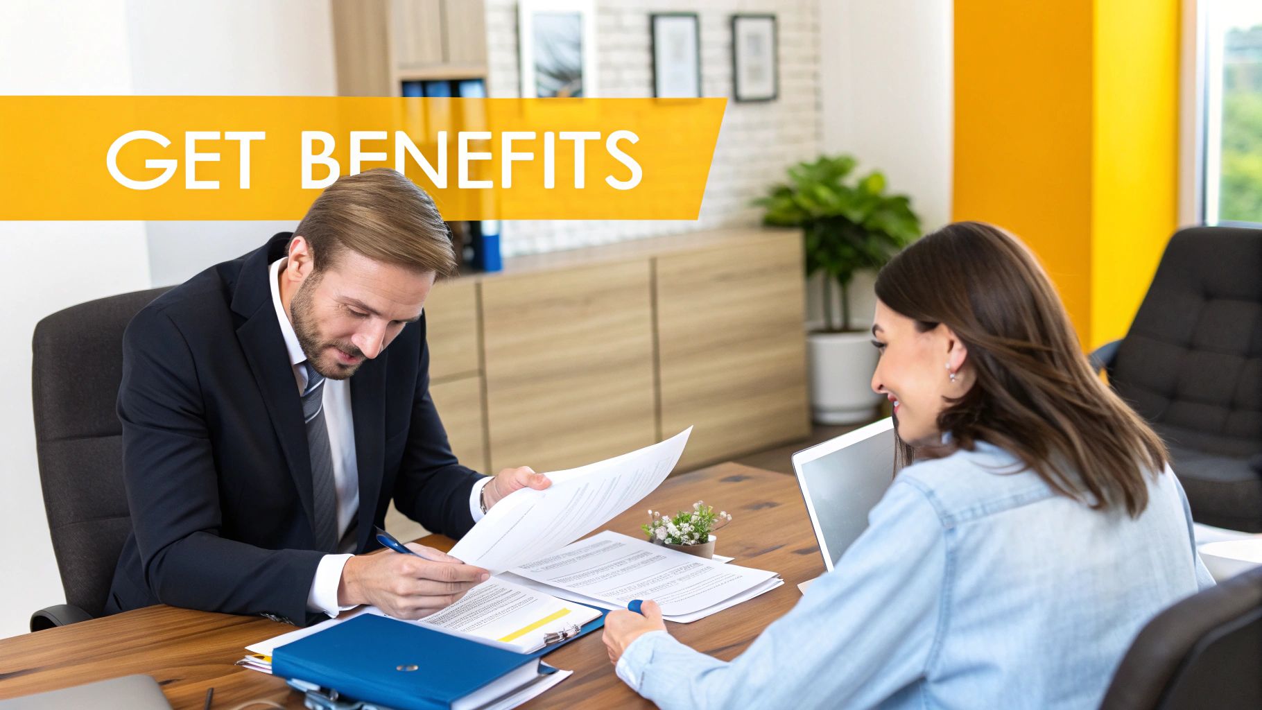 A lawyer and a client sitting at a table, looking over documents with a serious and focused expression.