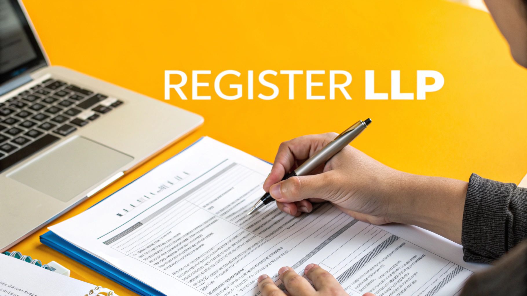 Person filling out a form with a pen, laptop, and 'REGISTER LLP' text on a yellow desk.