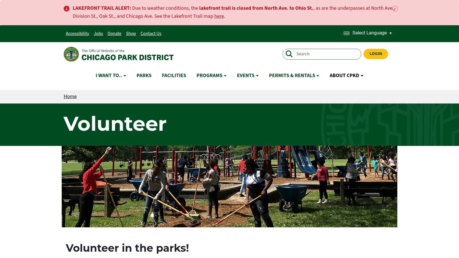 Volunteers working together in a Chicago park, tending to a community garden.