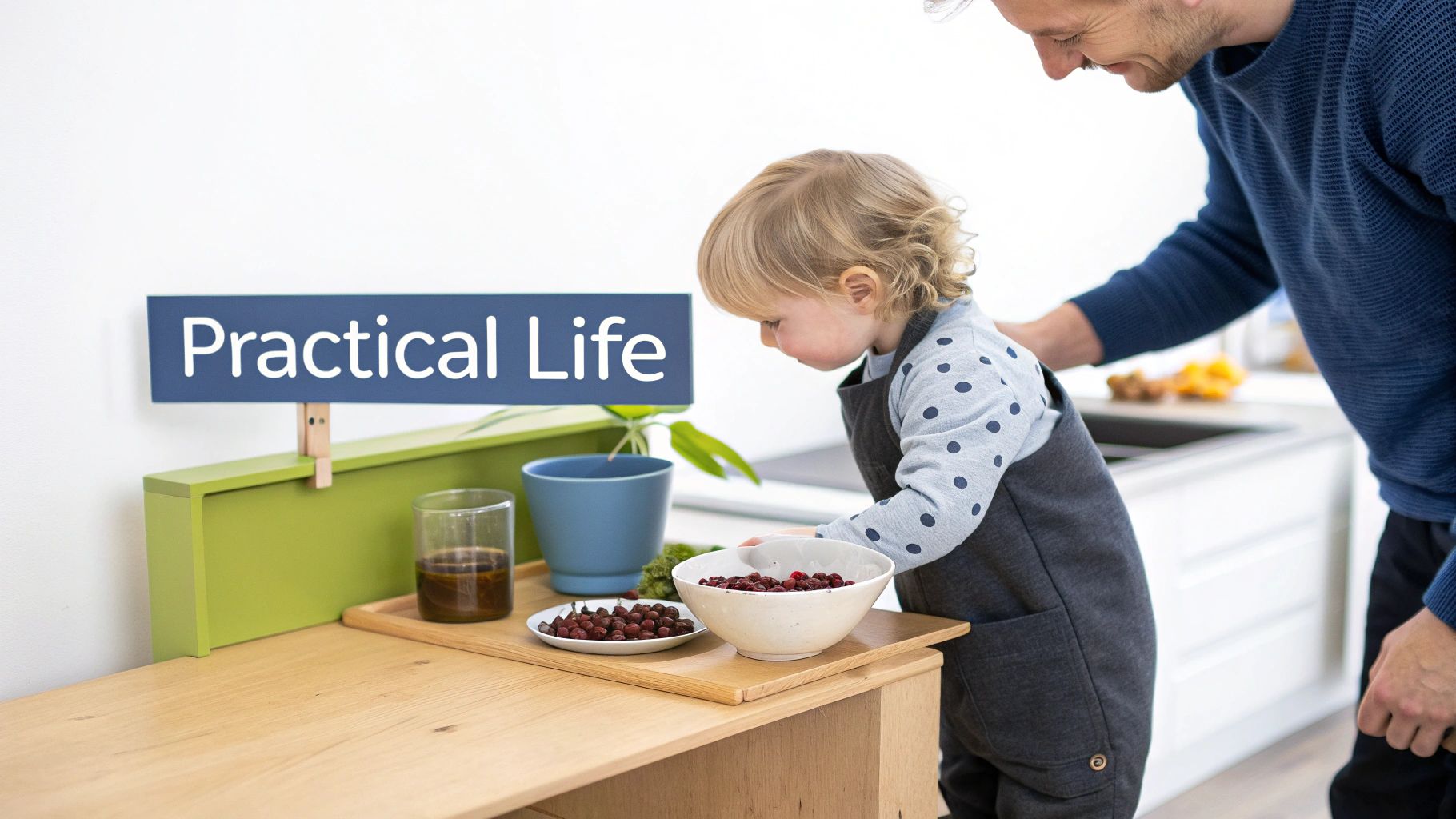 A smiling father watches a toddler practicing practical life skills with berries at a Montessori station.