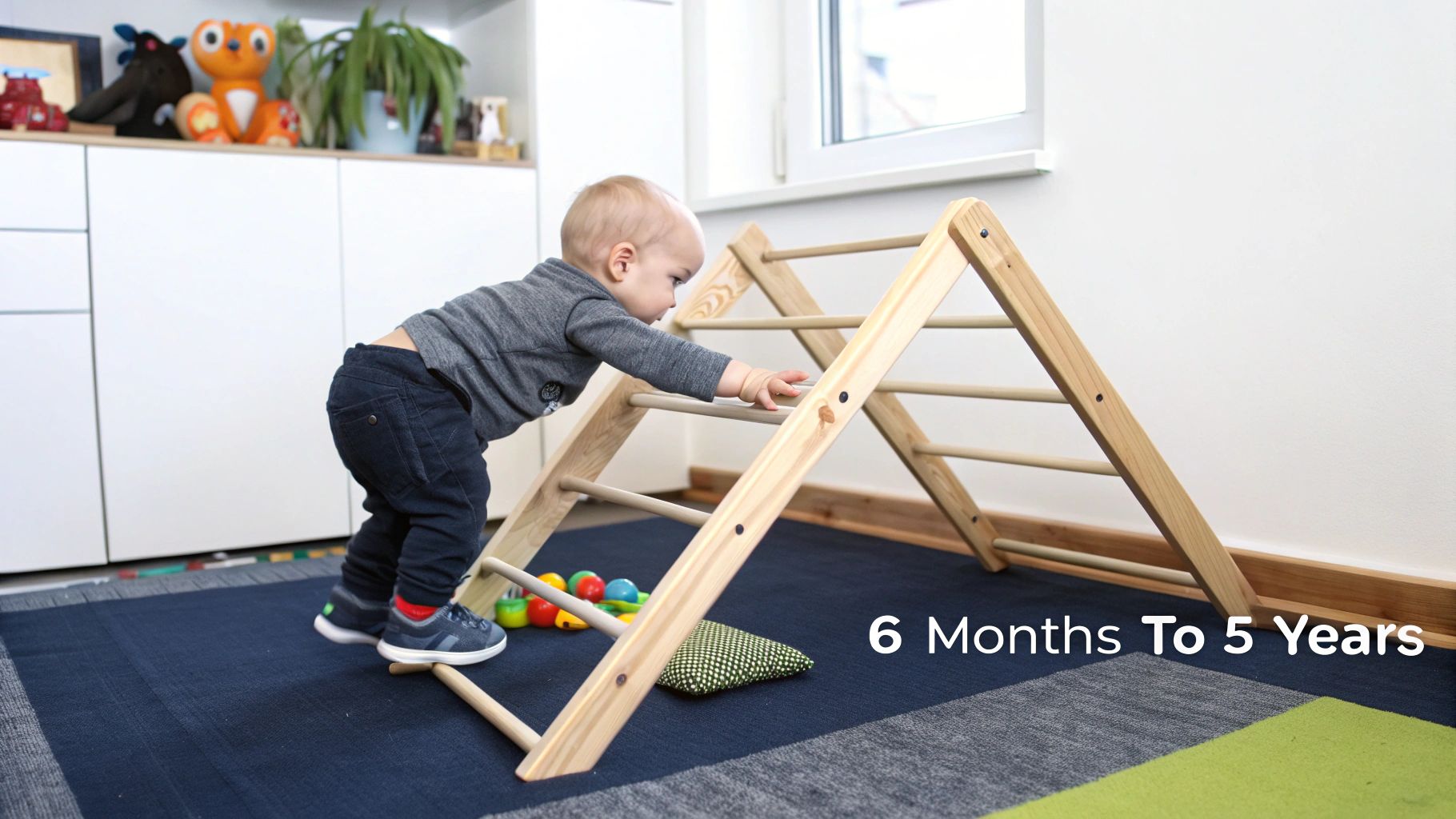 A young toddler confidently climbing a wooden Pikler Triangle in a brightly lit playroom.