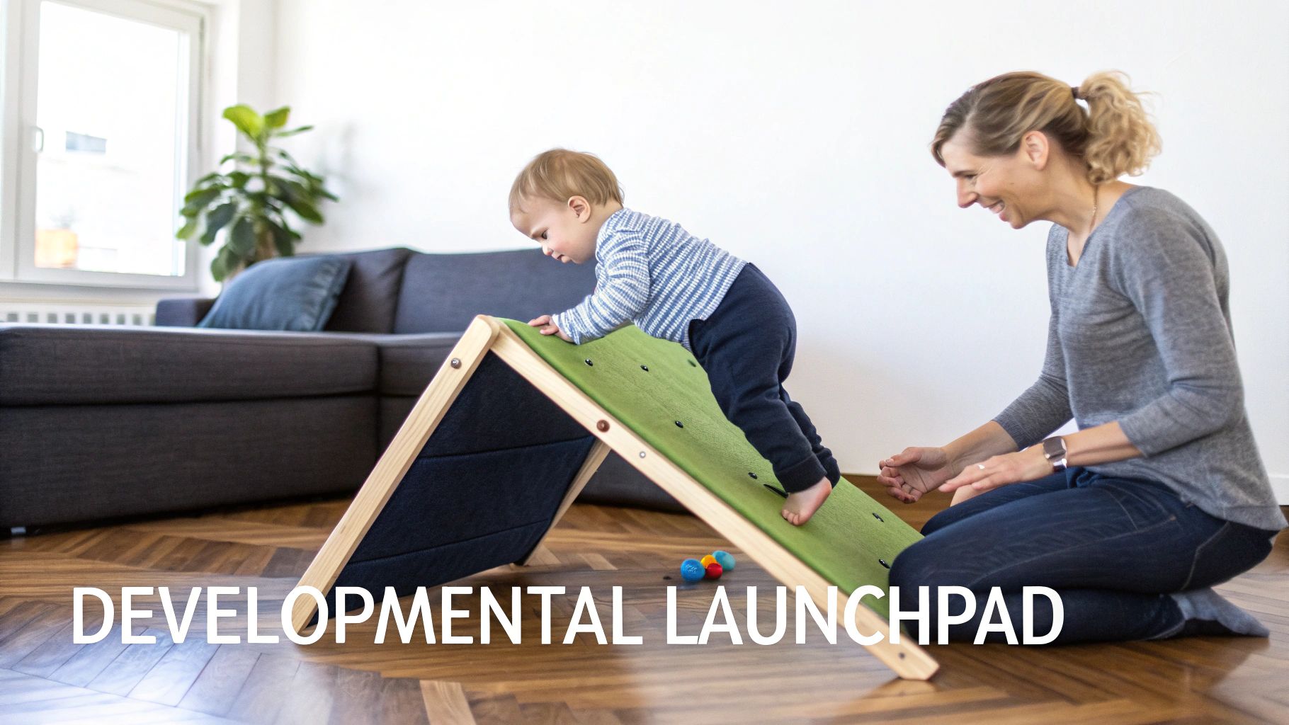 A happy baby climbs a green Pikler triangle while a smiling adult supervises nearby.