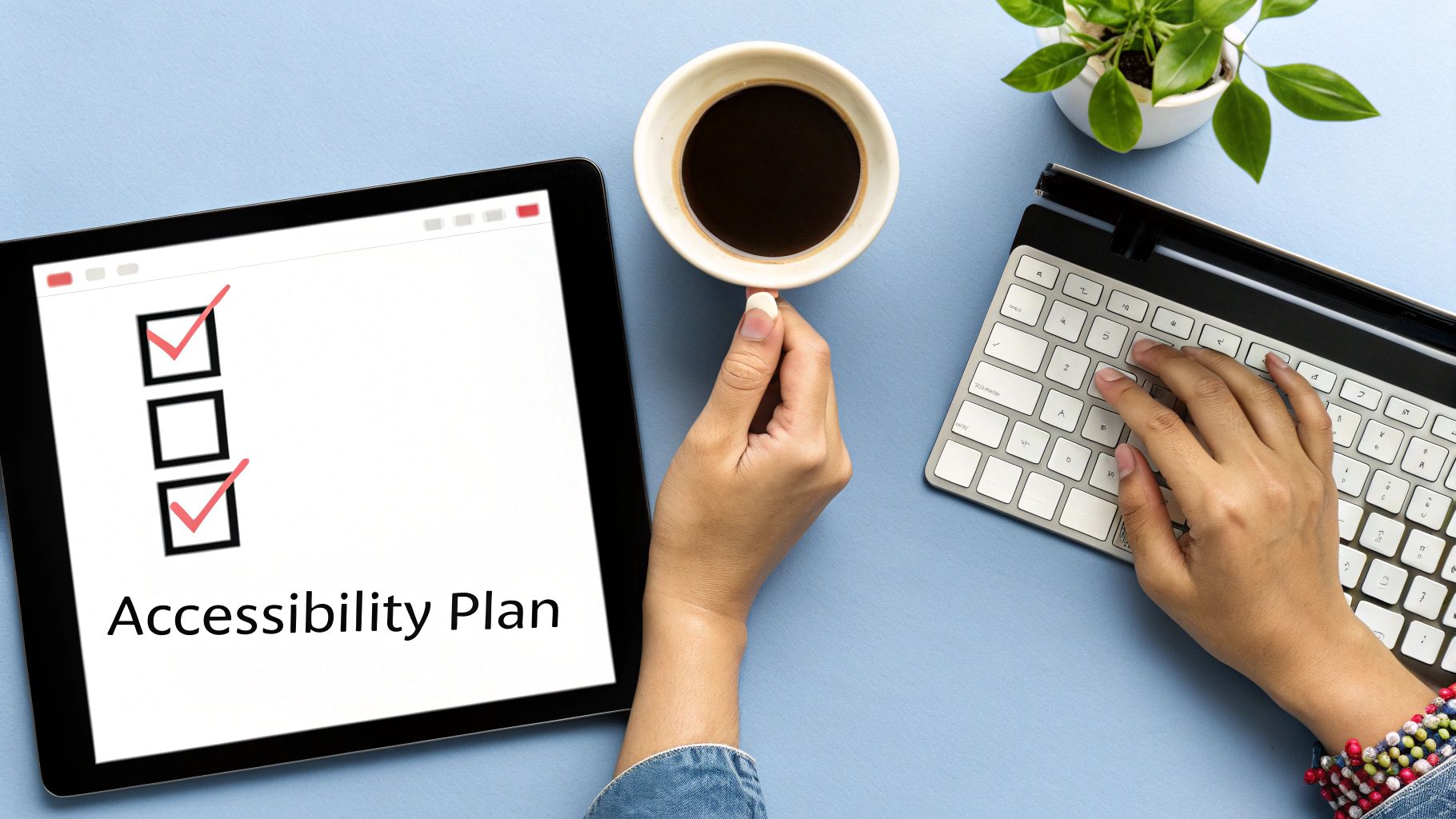 Hands working on a tablet showing an 'Accessibility Plan' checklist, typing on a keyboard, with coffee.