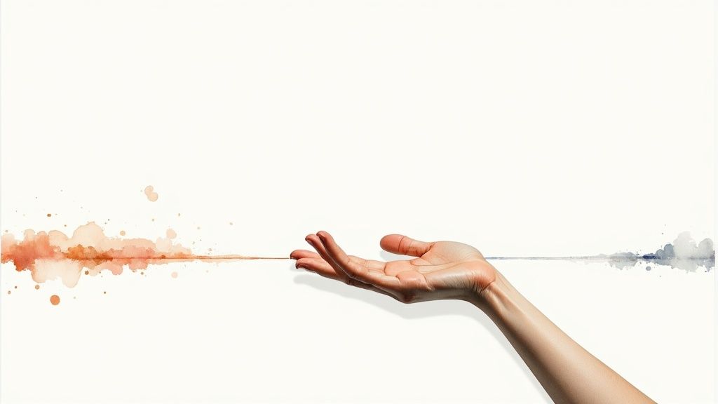 Eine menschliche hand verbindet orangefarbene und blaue aquarell-spritzer auf einem hellen hintergrund.