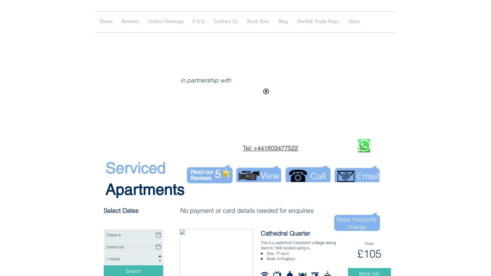 A modern, well-lit living area in a Stay Norwich Apartment, featuring a comfortable sofa, coffee table, and a dedicated workspace with a desk and chair.