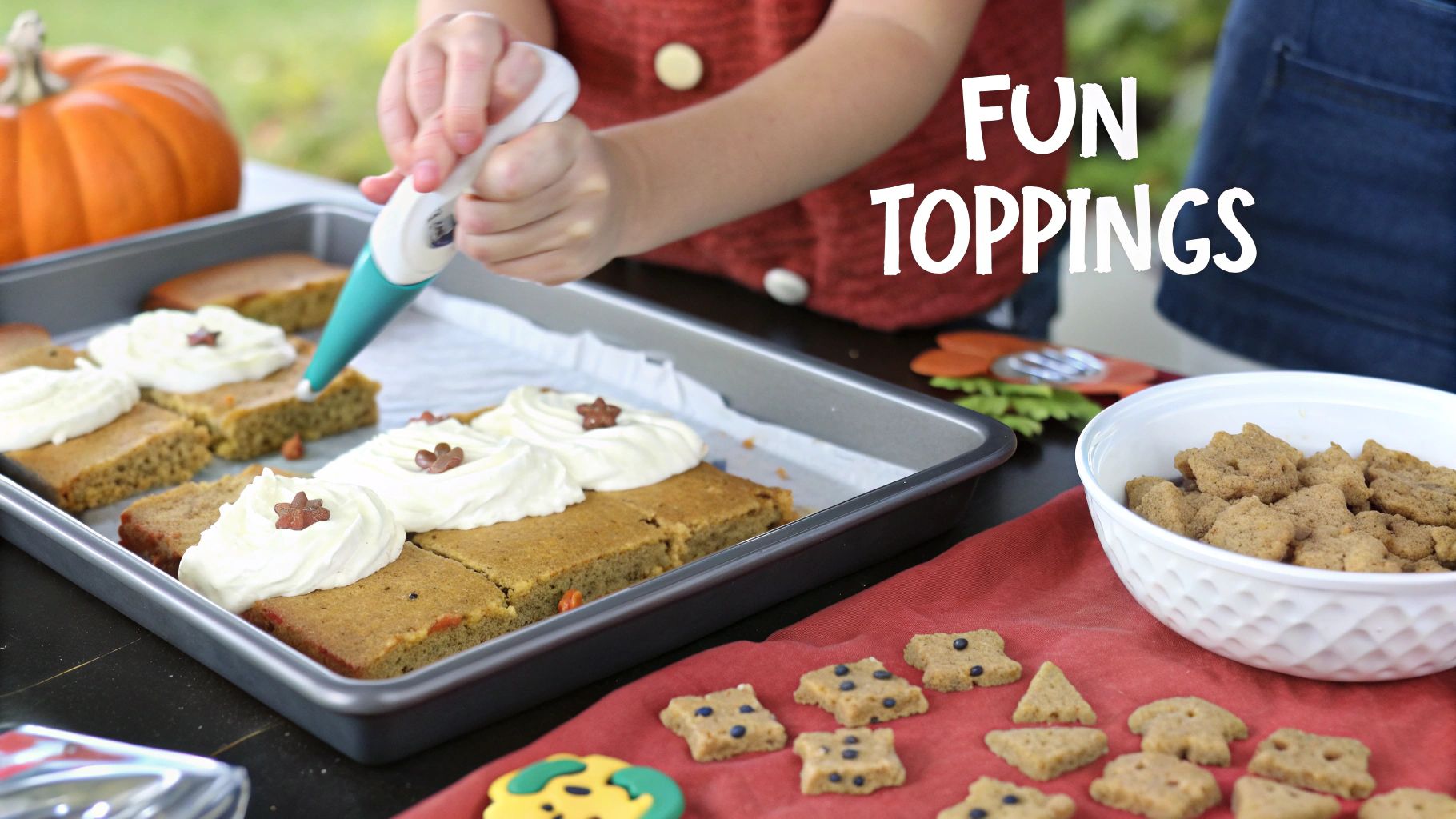 Child decorating vegan pumpkin bars with white frosting and fun autumn-themed toppings