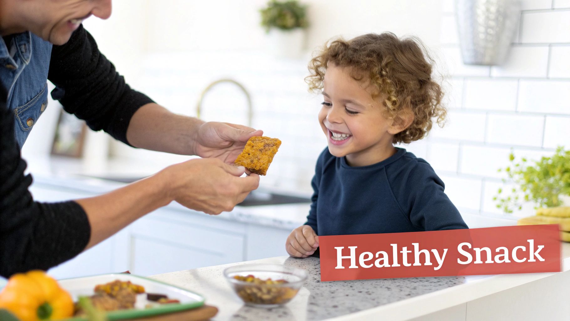 Parent offering healthy homemade snack to smiling child in bright modern kitchen