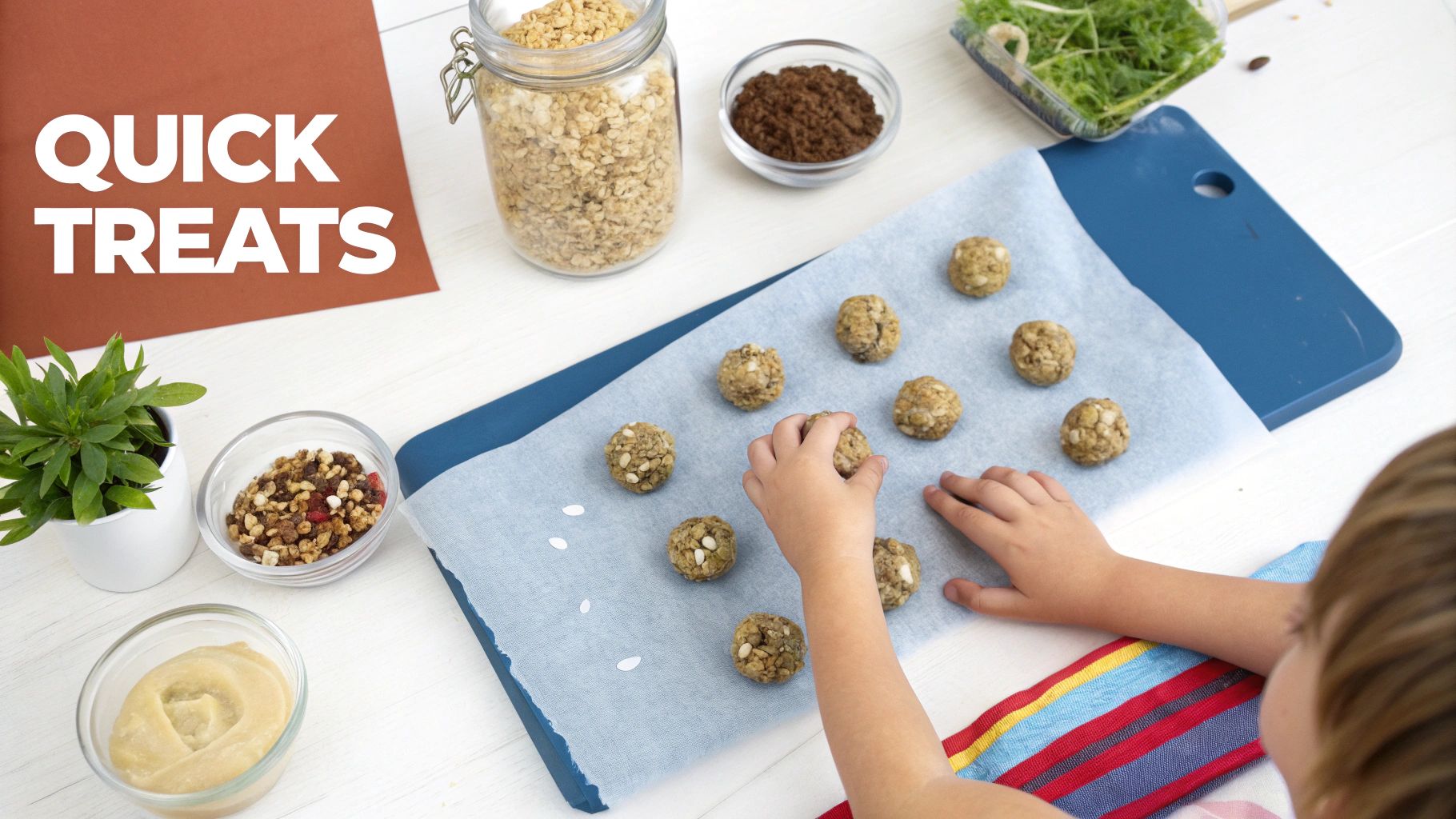 A child's hands placing round, healthy treats on a baking sheet, surrounded by ingredients.
