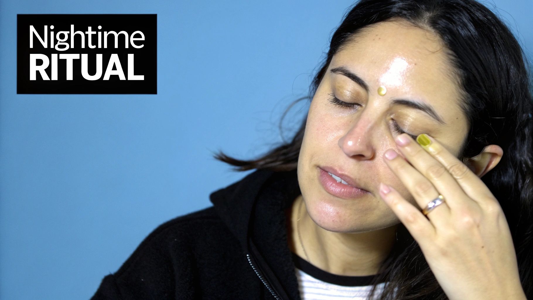 Woman carefully applying a skincare product under her eye