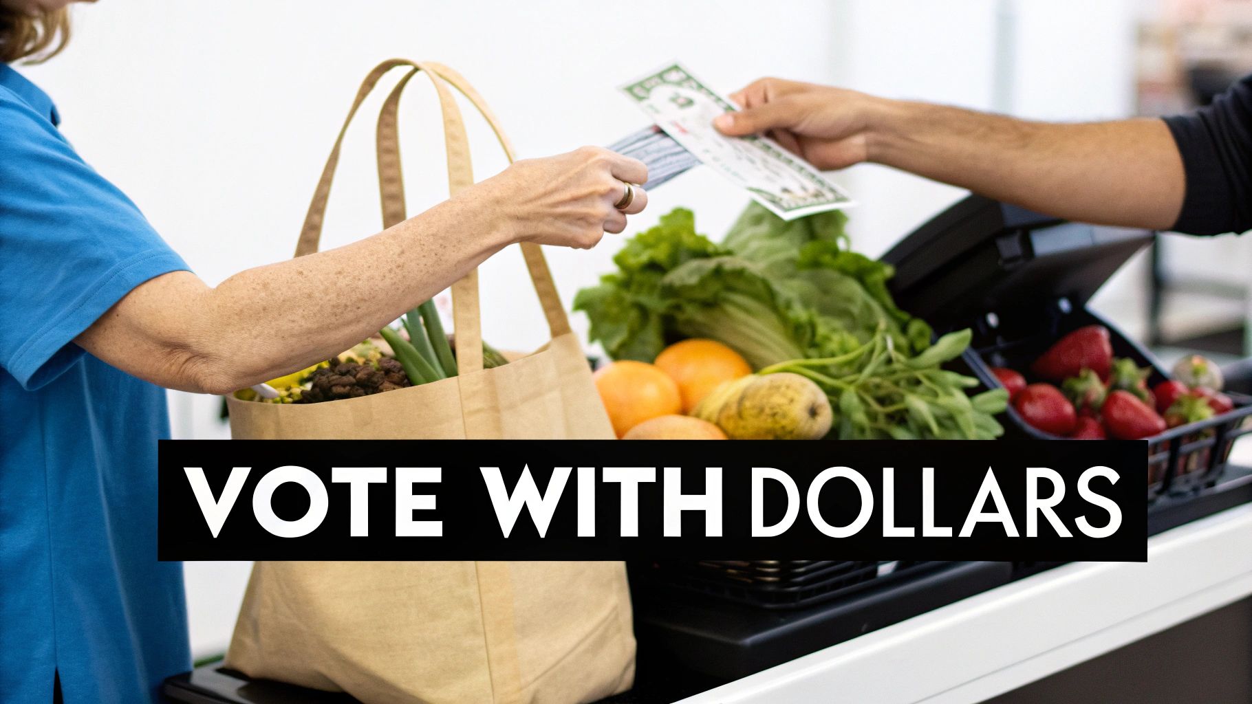 A person paying with a credit card at a local market stall filled with fresh produce.