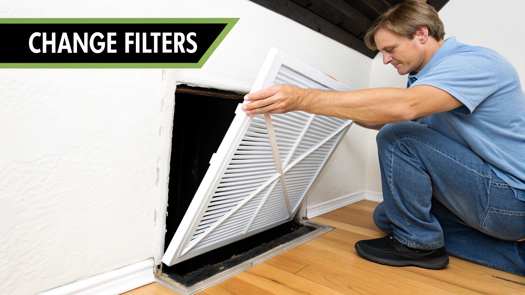 A man kneels to change a dirty air filter in a floor vent, promoting regular maintenance.