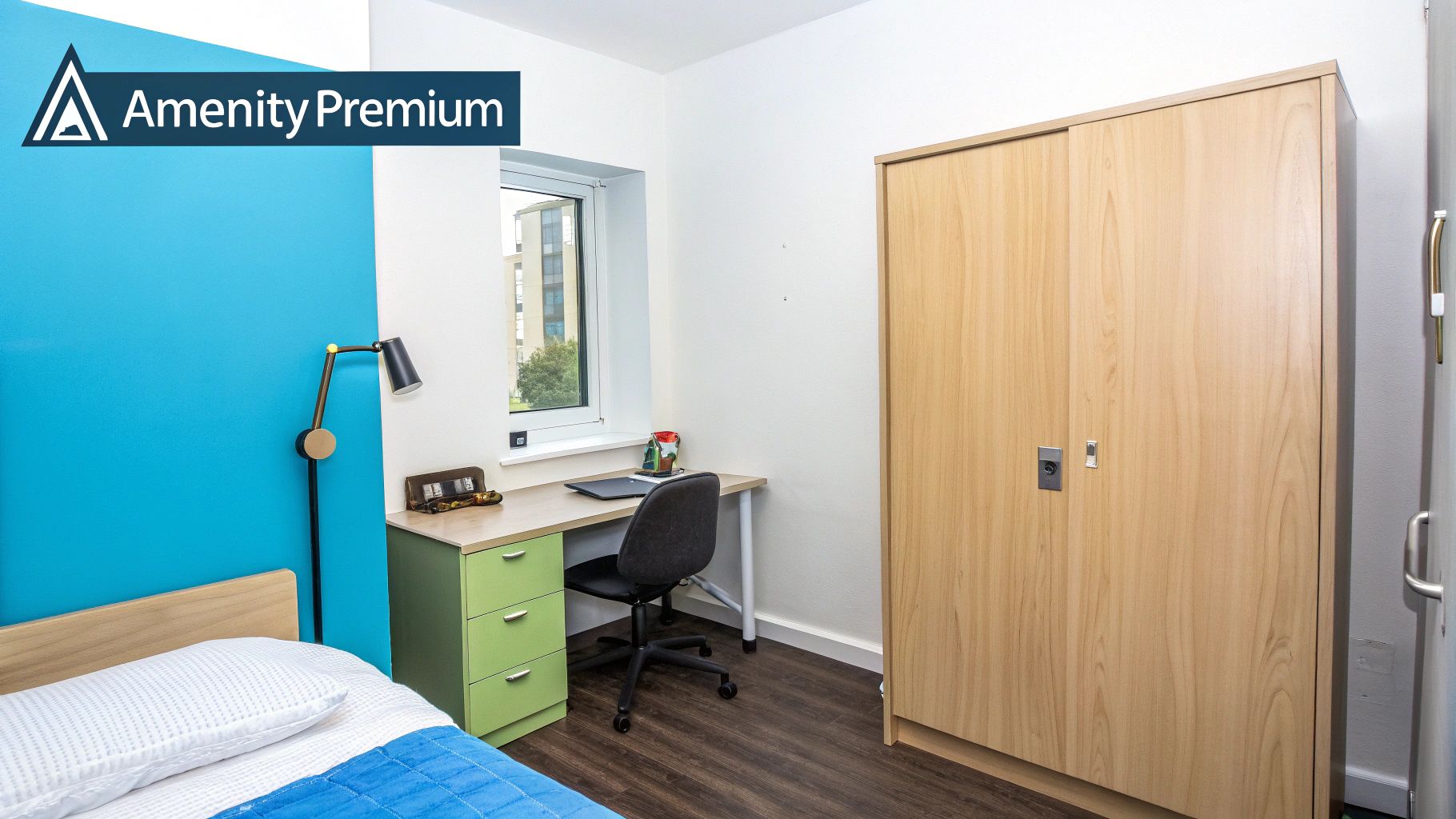 Modern student bedroom with a bed, desk, chair, wooden wardrobe, and a blue wall.
