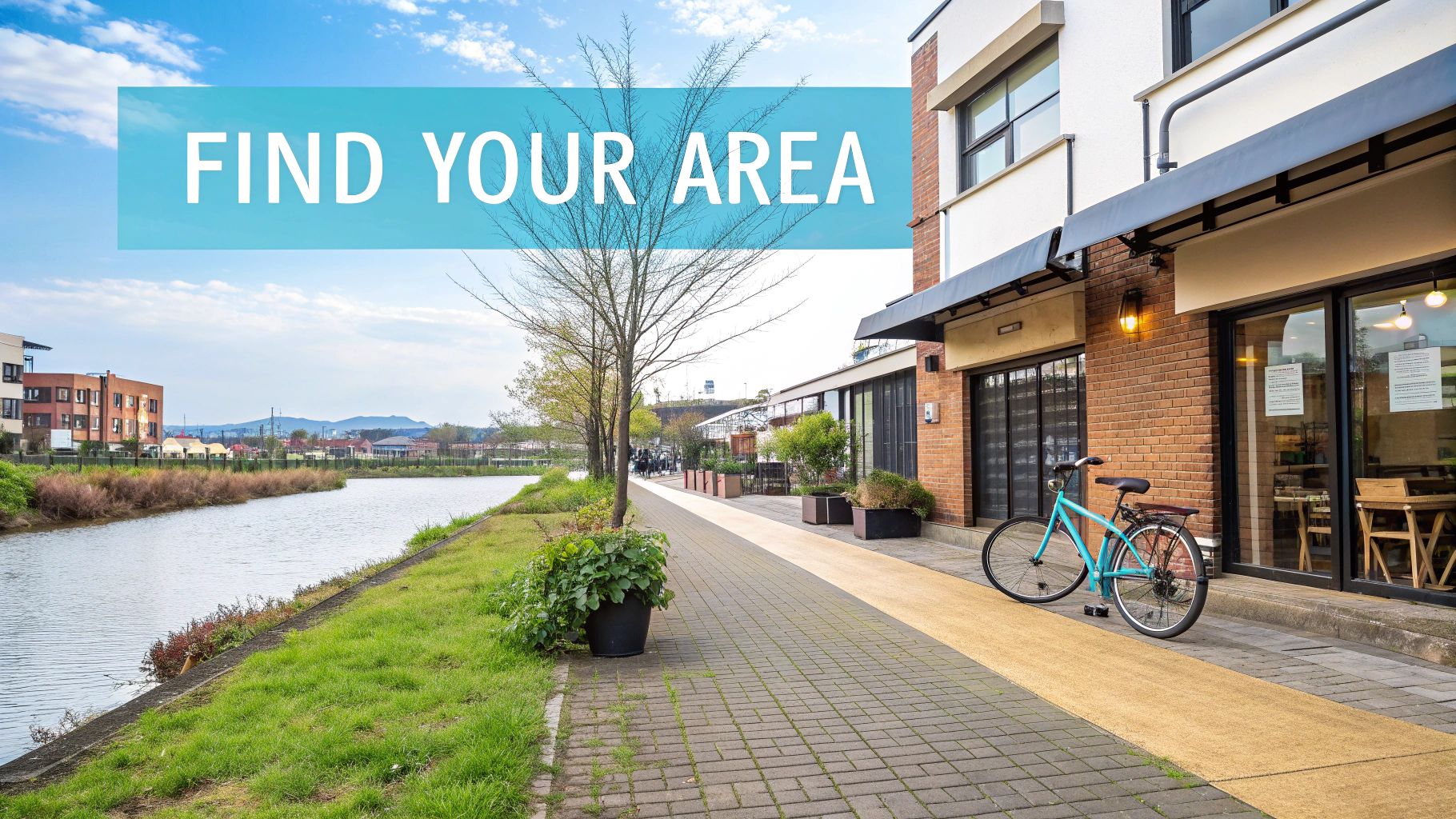 Modern riverside development with apartment buildings, canal path, bike and storefronts for area exploration