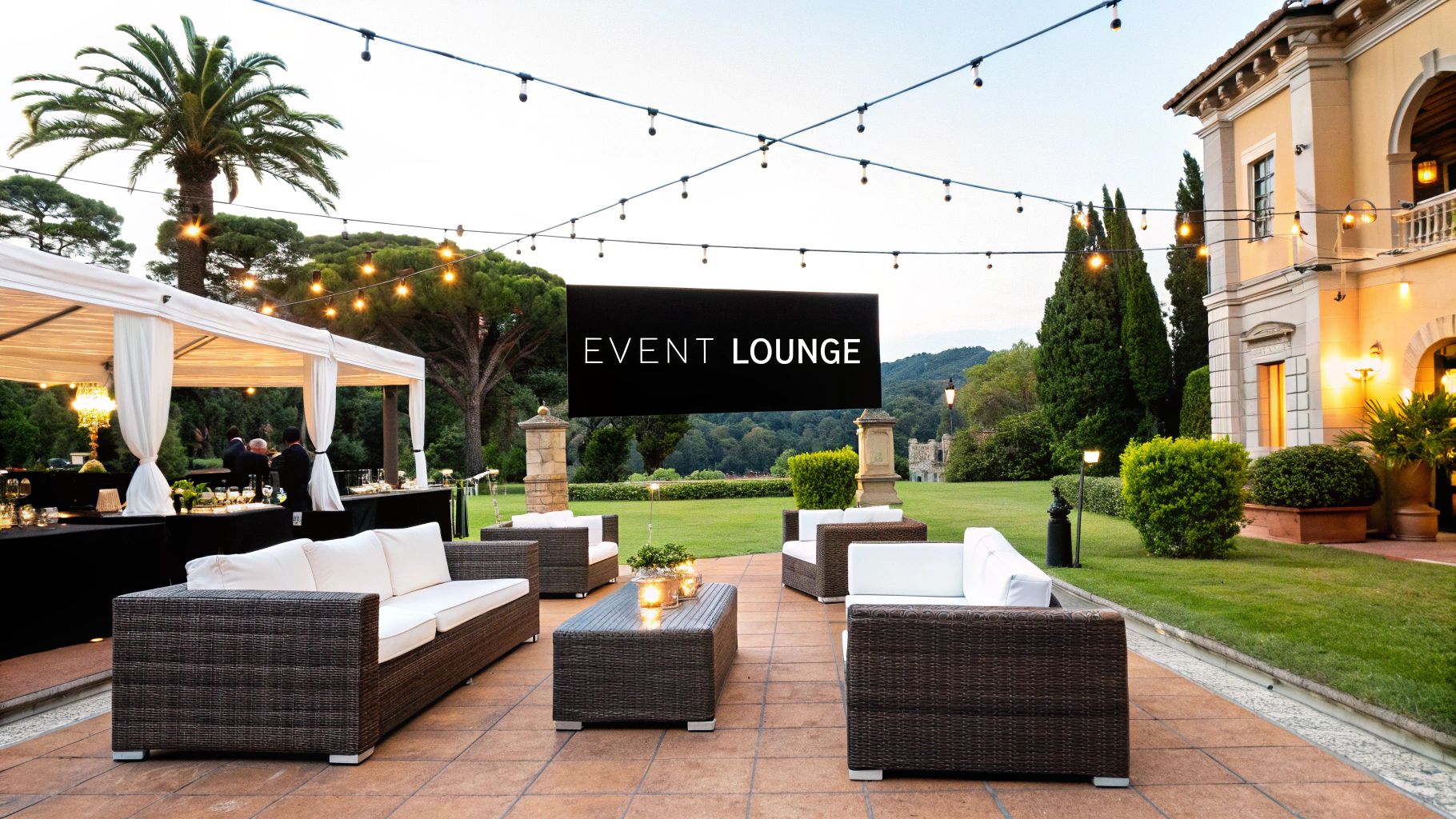 An elegant outdoor event with rented lounge sets arranged for guest comfort.