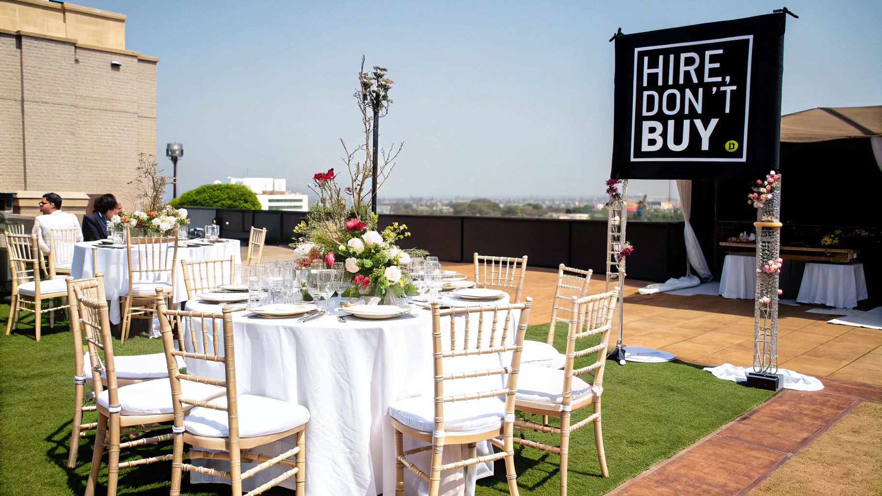 A beautifully decorated event table with elegant chairs, showcasing hired decor