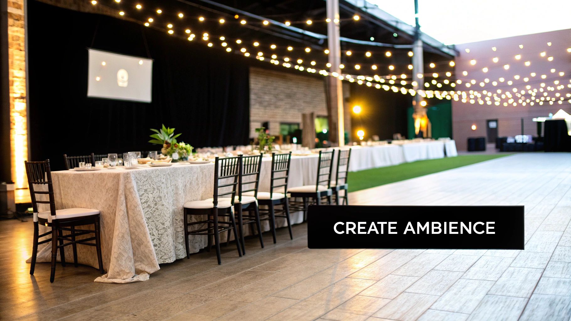 Elegant party setup with long tables, flowers, and sophisticated lighting.