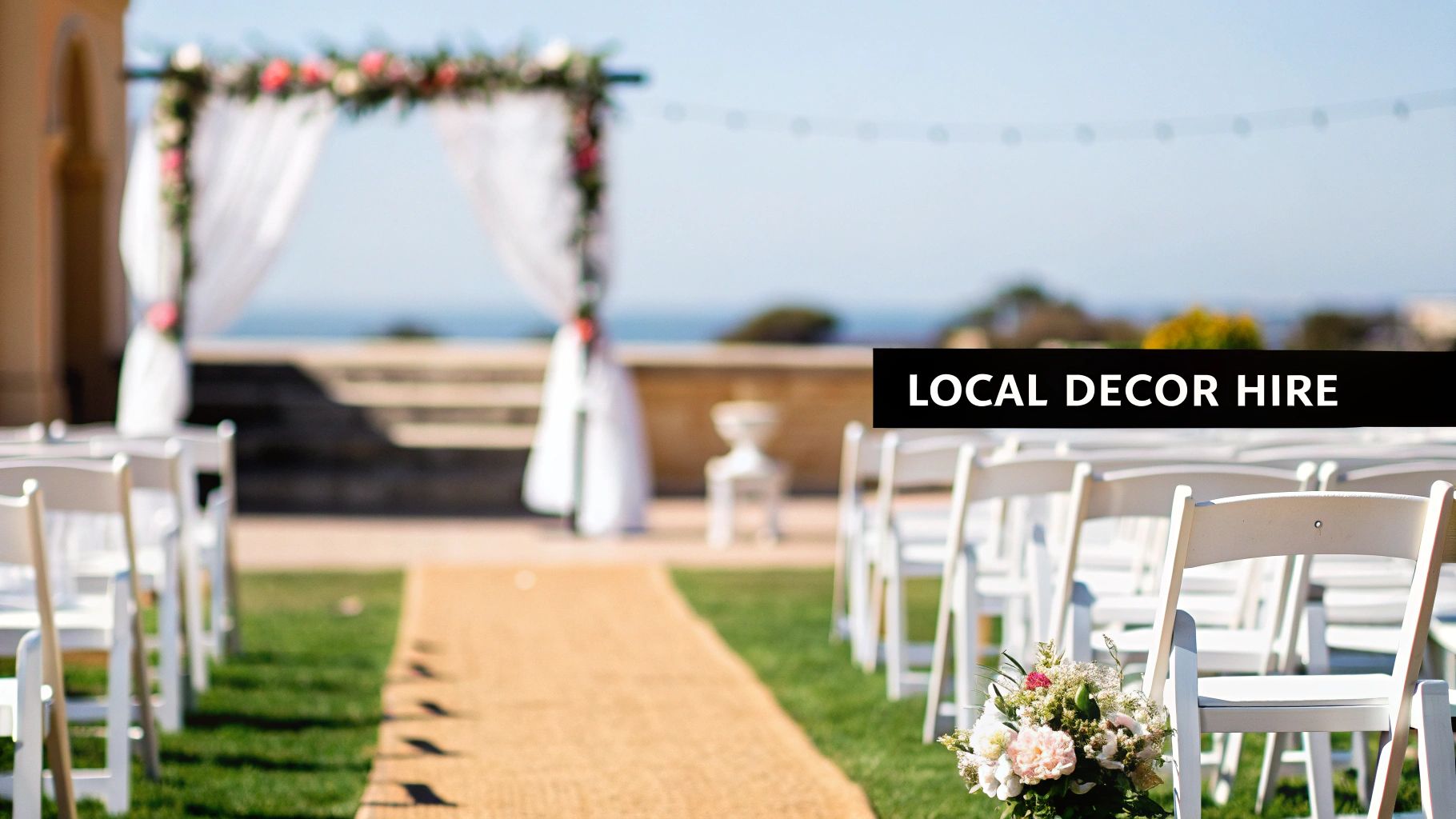 Outdoor wedding ceremony setup with white chairs, a brown aisle, and a floral arch, with text 'LOCAL DECOR HIRE'.