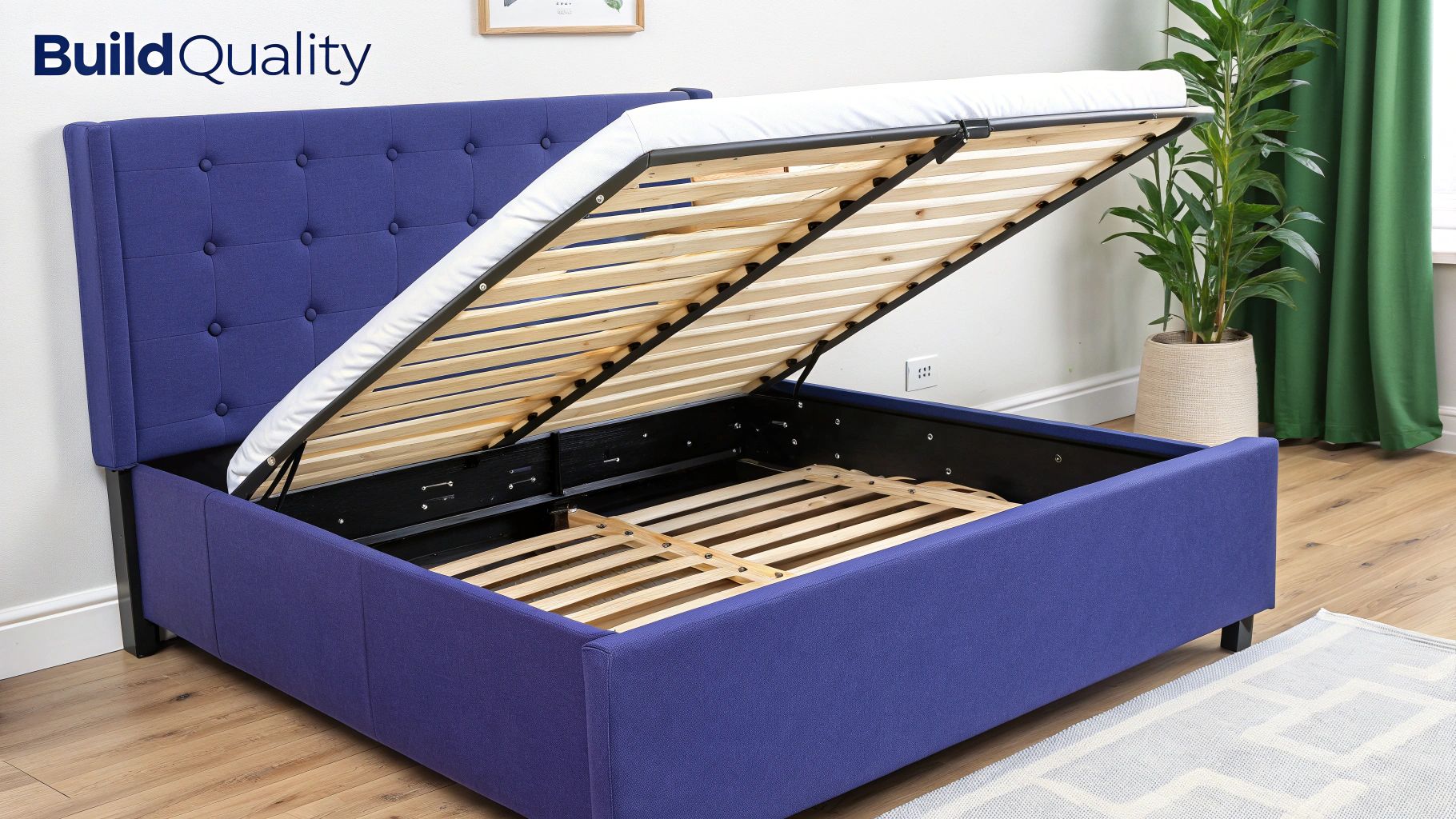 A blue fabric storage bed with the mattress lifted, revealing the wooden slatted base and internal storage space.