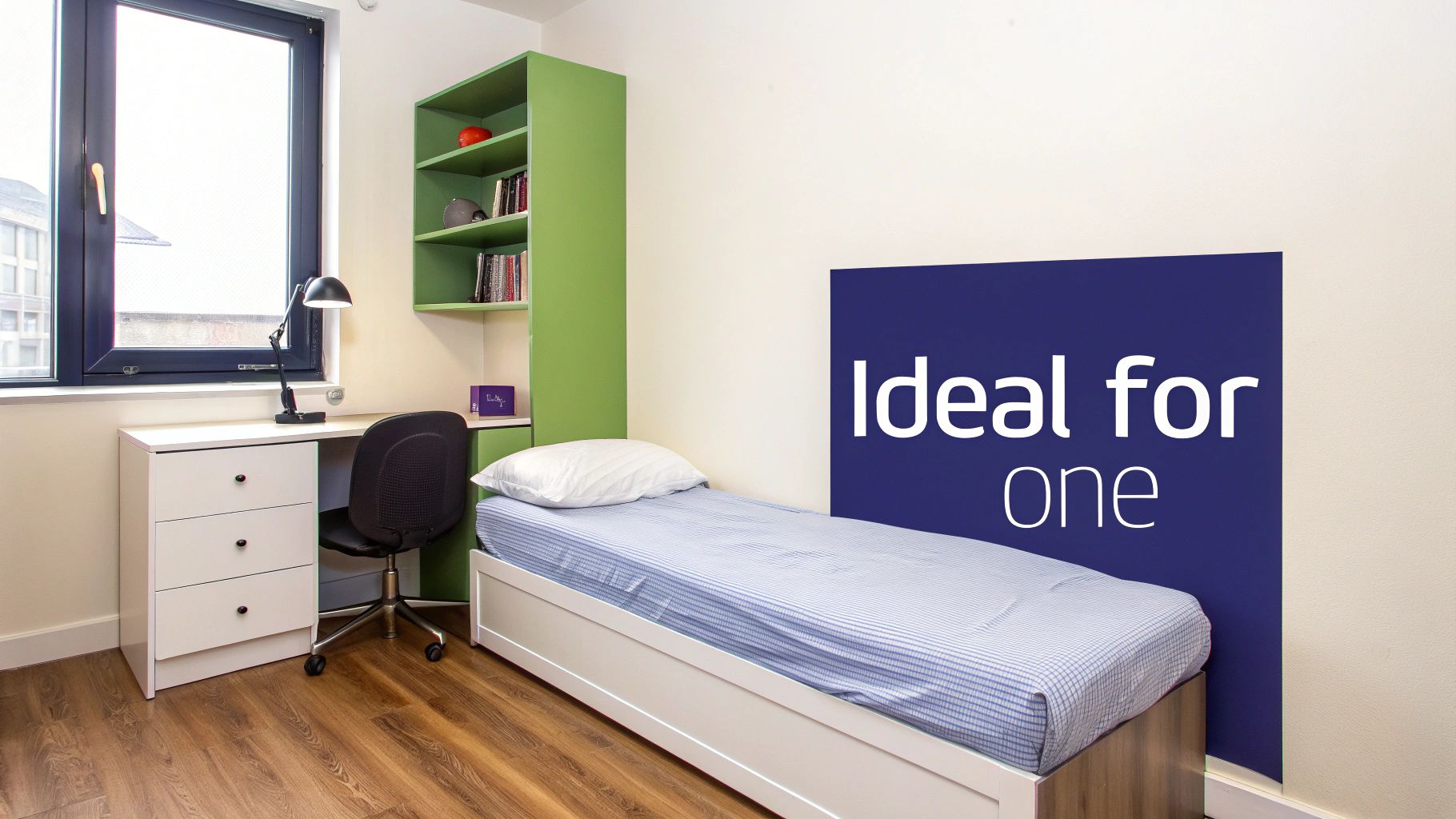 A child sleeping peacefully in a single bed with bright, colourful bedding.