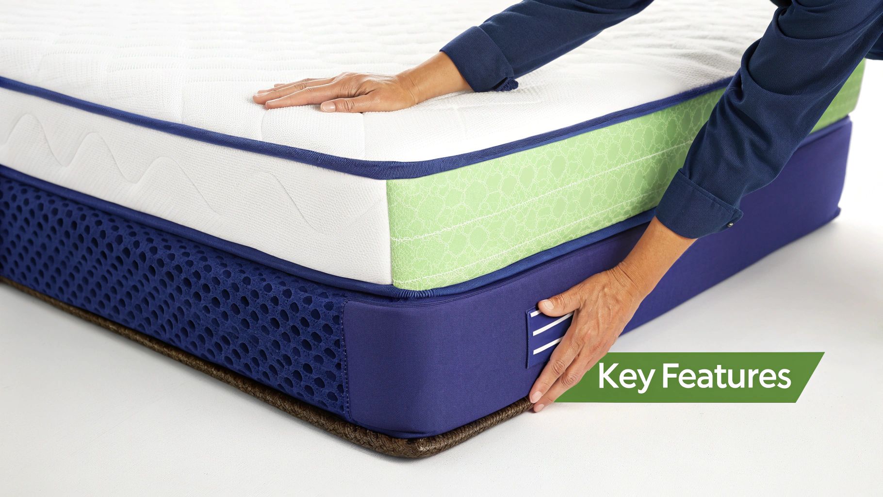 A couple happily lying on a mattress, showcasing its comfort and features.