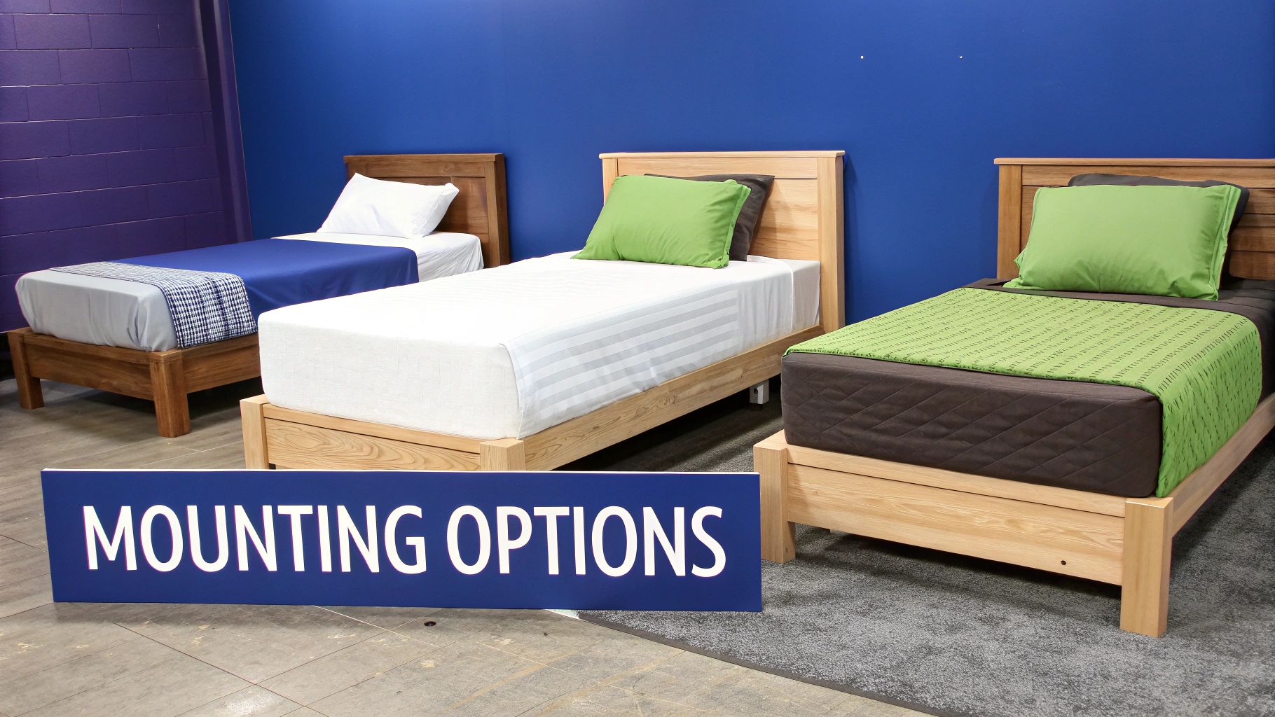 Three single wooden beds with varied bedding and pillows, with a 'MOUNTING OPTIONS' sign.