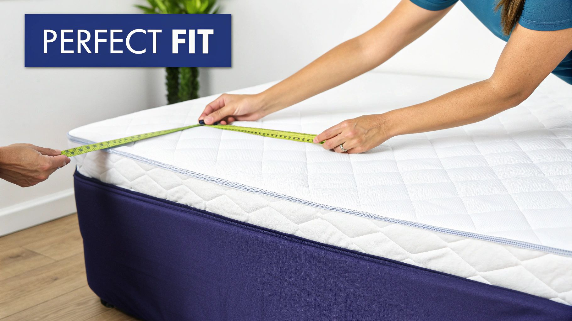Two people use a tape measure to get the perfect fit for a white mattress.