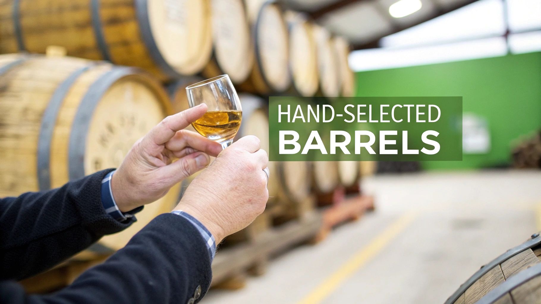 Several barrels of bourbon aging in a dimly lit warehouse rack