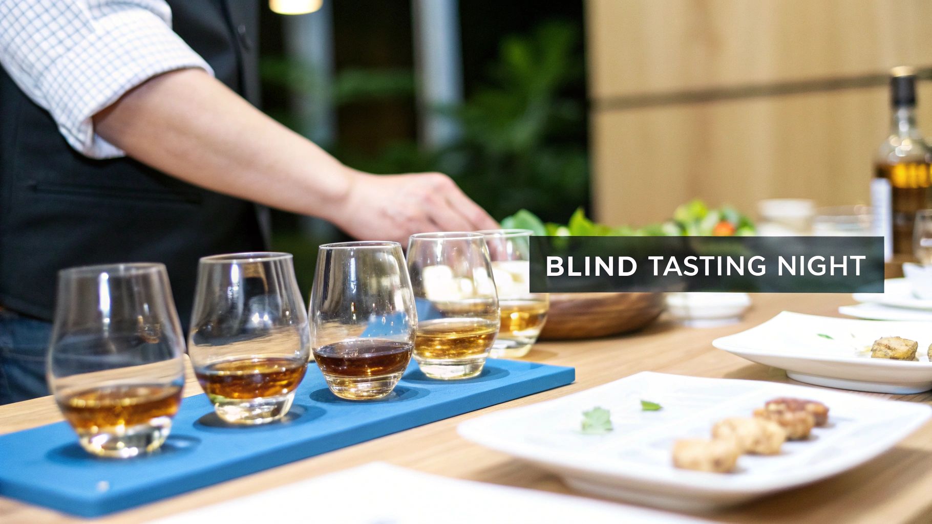 A blind tasting night featuring whiskey in glencairn glasses paired with small bites on a table.