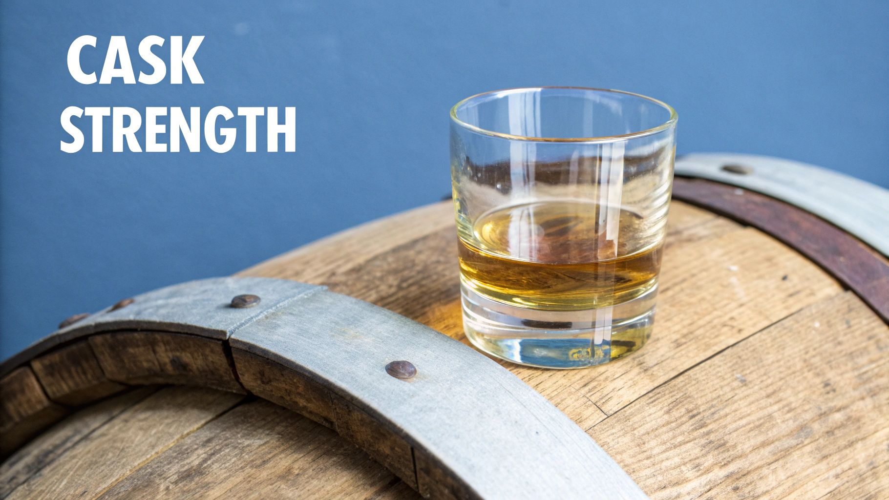A whiskey glass and bottle sitting next to a rustic barrel, representing the journey from cask to glass.