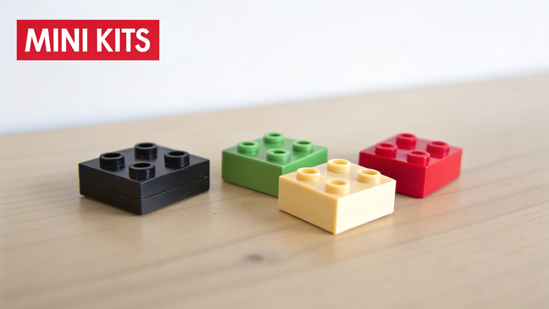 Four colorful LEGO-style bricks (black, green, yellow, red) on a wooden surface, with 'MINI KITS' text.