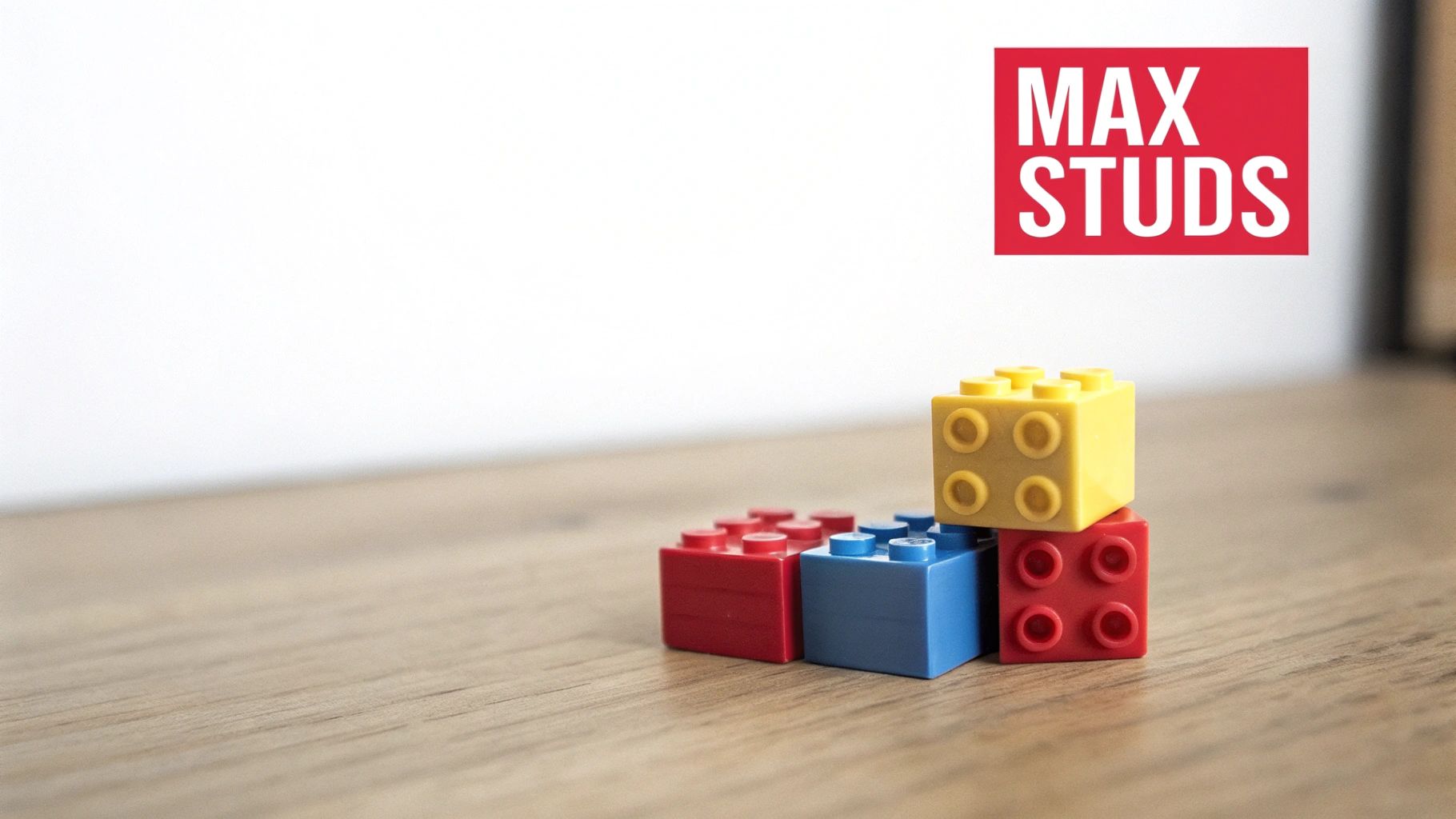 Colorful Lego bricks stacked on a wooden surface with a 'MAX STUDS' logo.