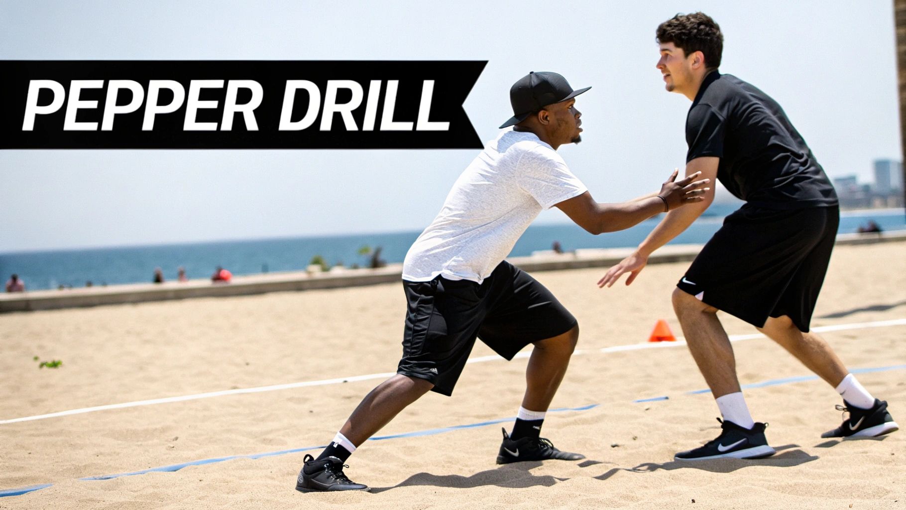 Two men doing a 'Pepper Drill' on a beach volleyball court with the ocean behind them.