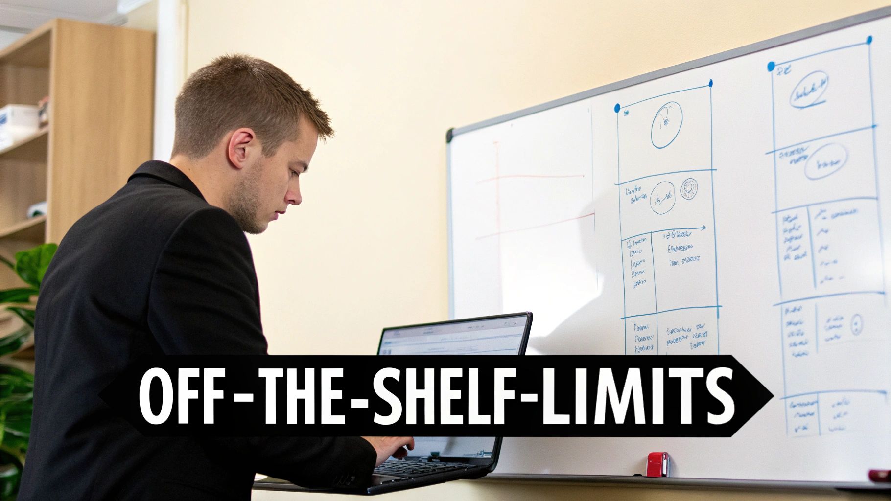 Business team collaborating on a software project on a glass wall