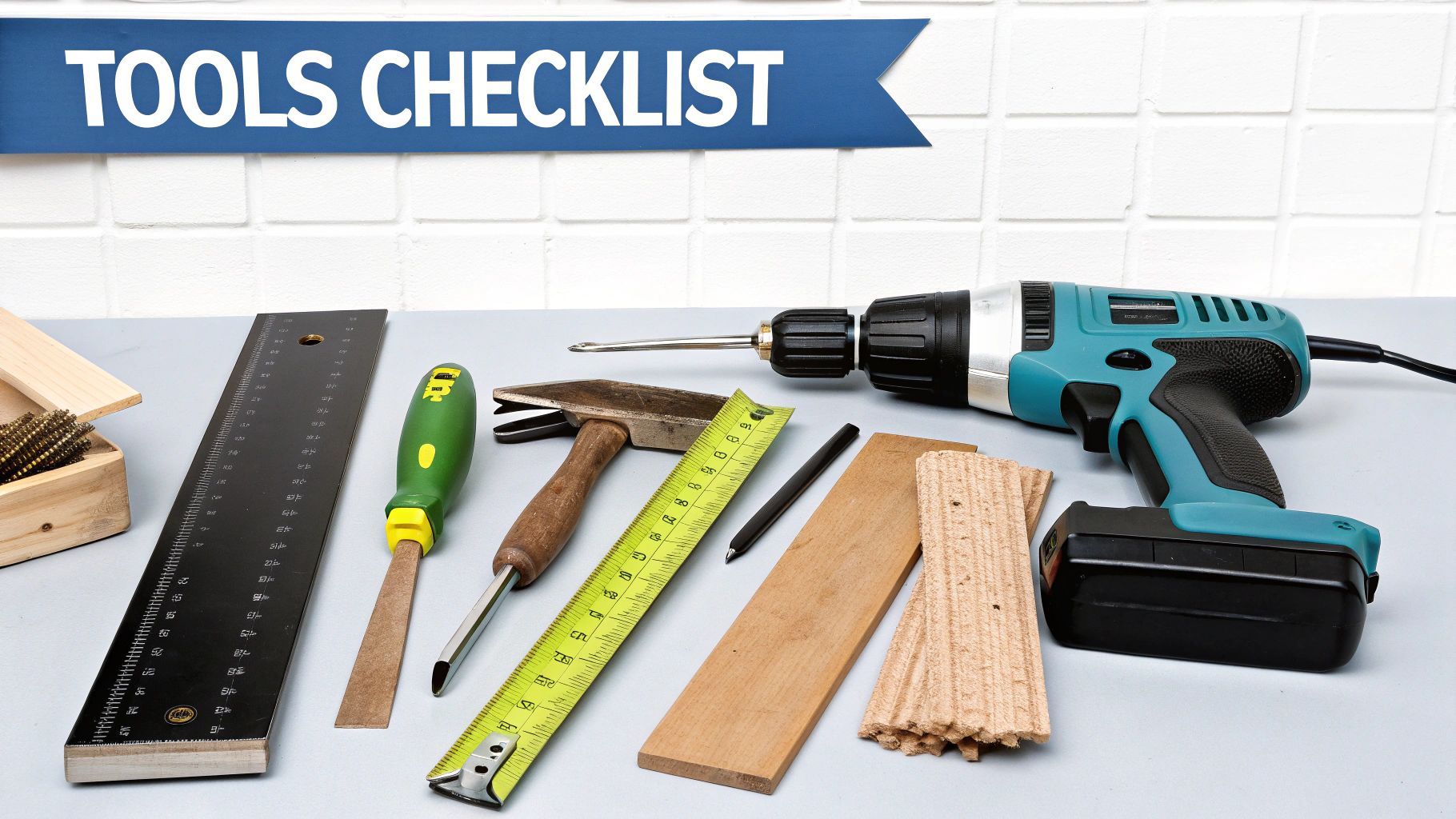 Essential carpentry and construction tools like a drill, hammer, measuring tape, and ruler on a workbench.