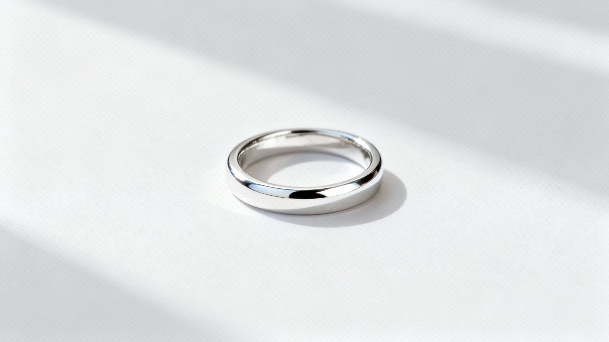 A pair of rhodium-plated rings with a dazzling, brilliant shine.