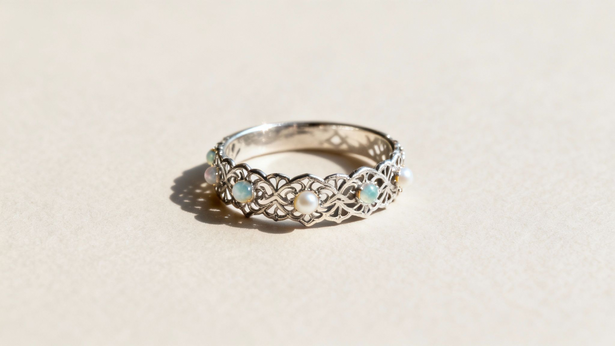 A collection of intricate sterling silver rings with various gemstones and designs.