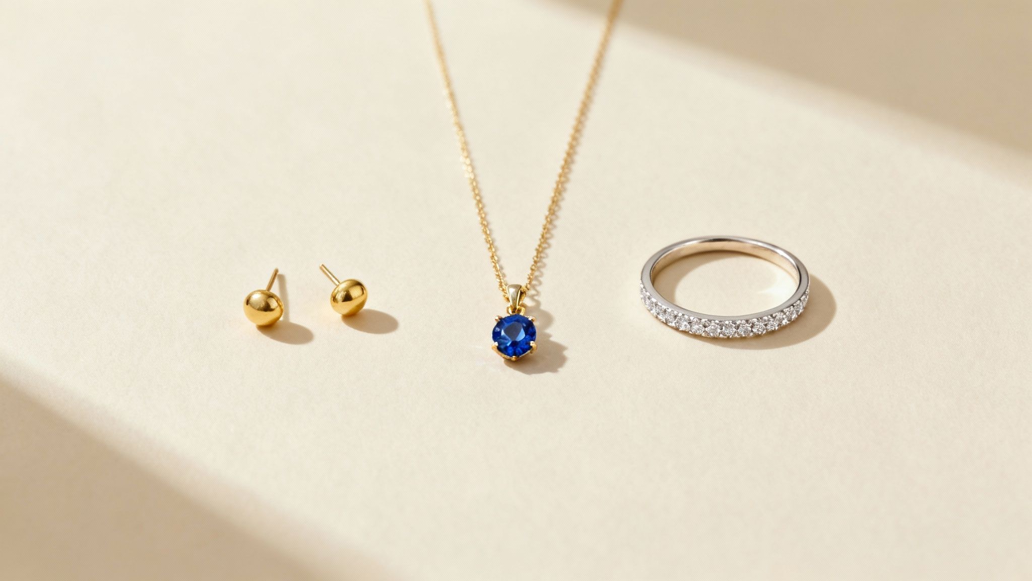 A couple holding hands, showcasing their wedding rings.