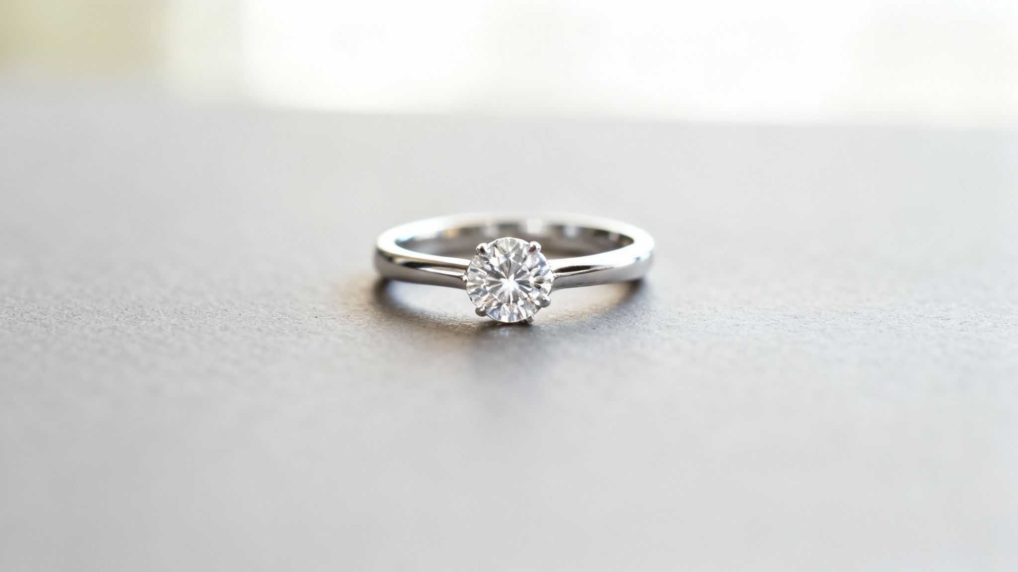 A stunning solitaire engagement ring with a round-cut diamond on a simple band.
